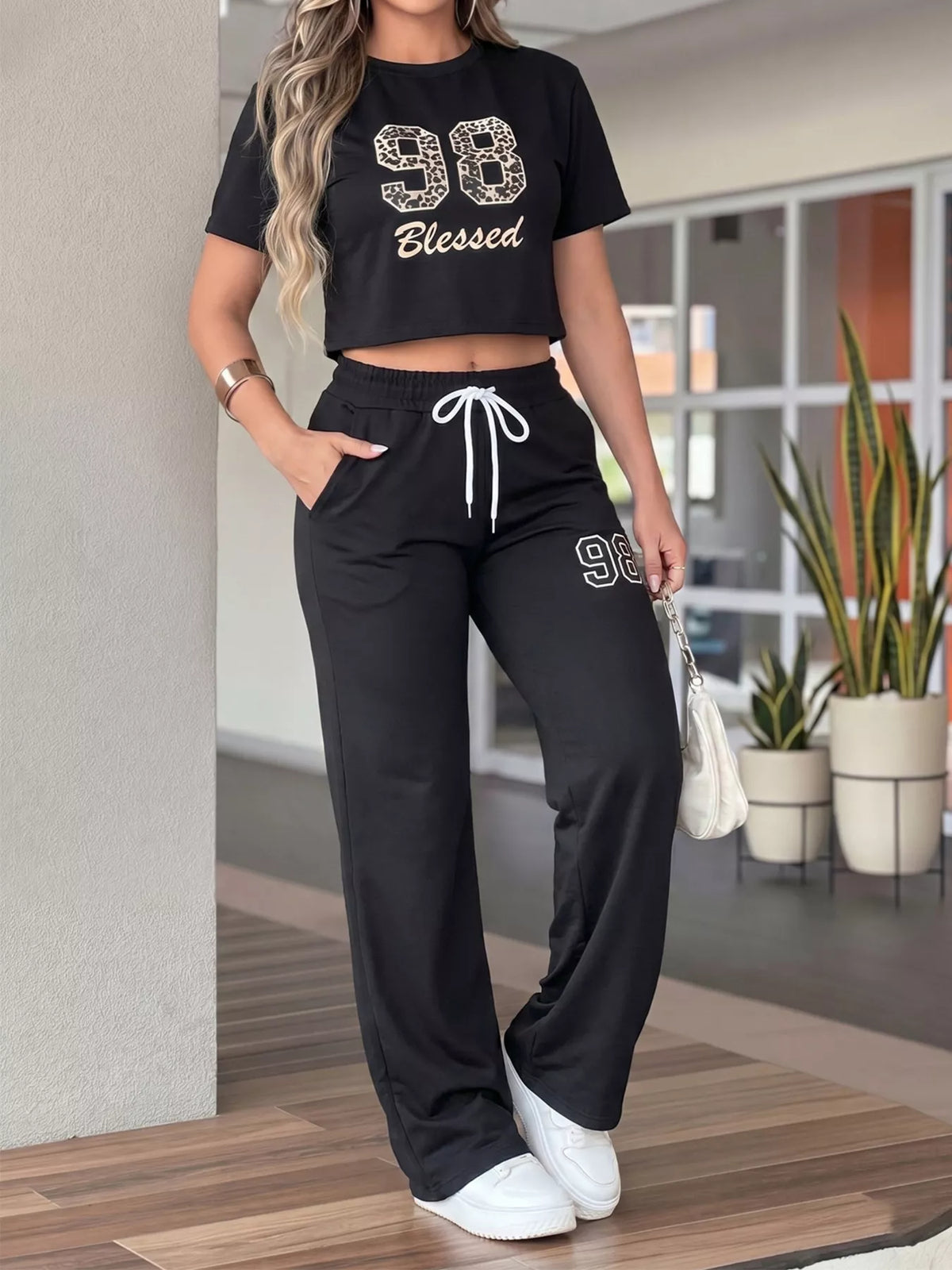 Leopard print crop top and wide-leg pants set by Plush Fashion Hub, stylish two-piece outfit with bold animal print.