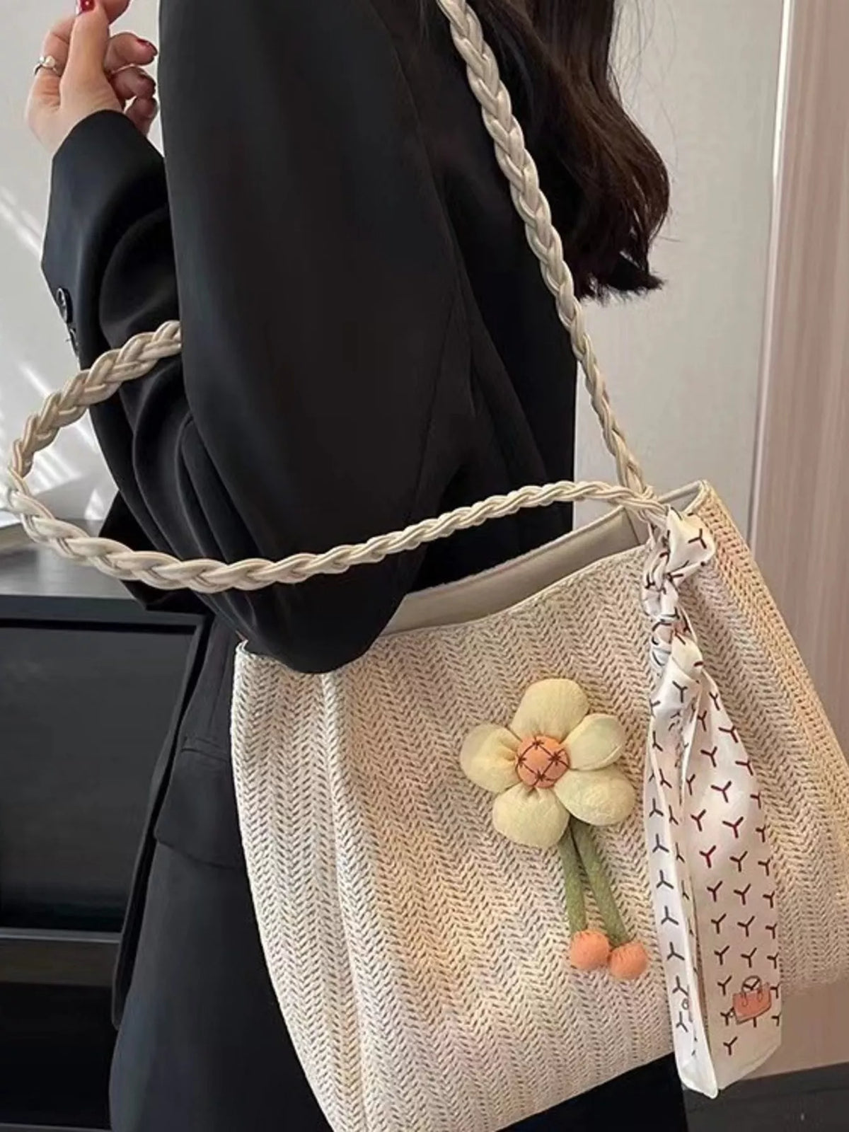 Woven straw tote bag with floral decor from Plush Fashion Hub, featuring a natural woven texture and floral accents for stylish carry.