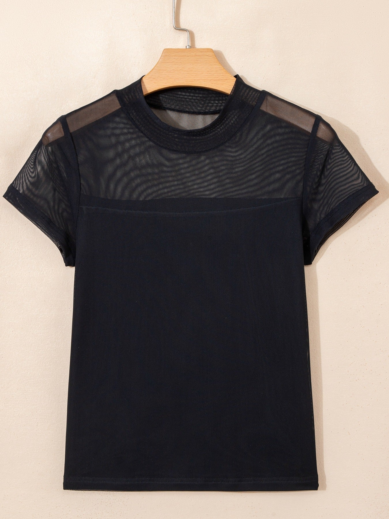 Women's sheer mesh patchwork cap sleeve T-shirt by Trendsi, featuring elegant layering design and stylish rings detail.