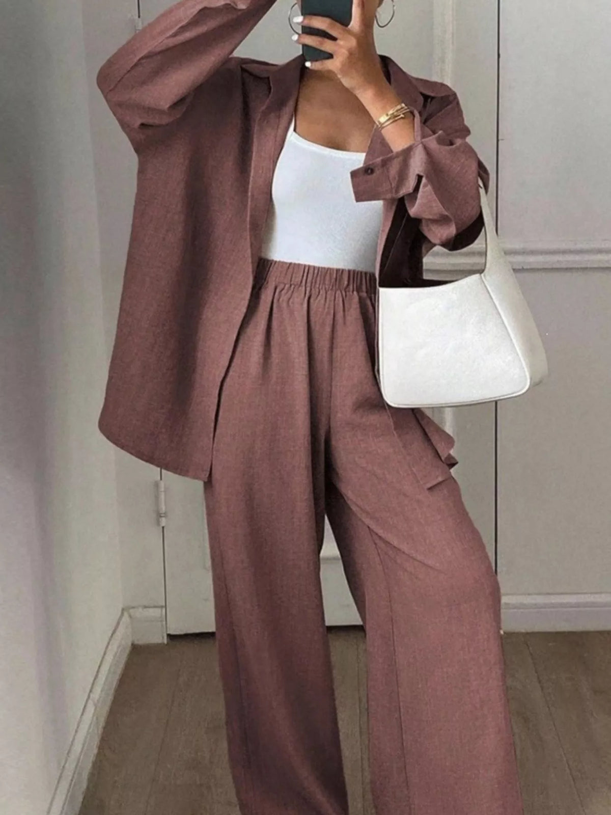 Trendsi long sleeve button-up shirt and wide-leg pants set, stylish coordinated outfit, in neutral tones, ideal for casual or office wear.