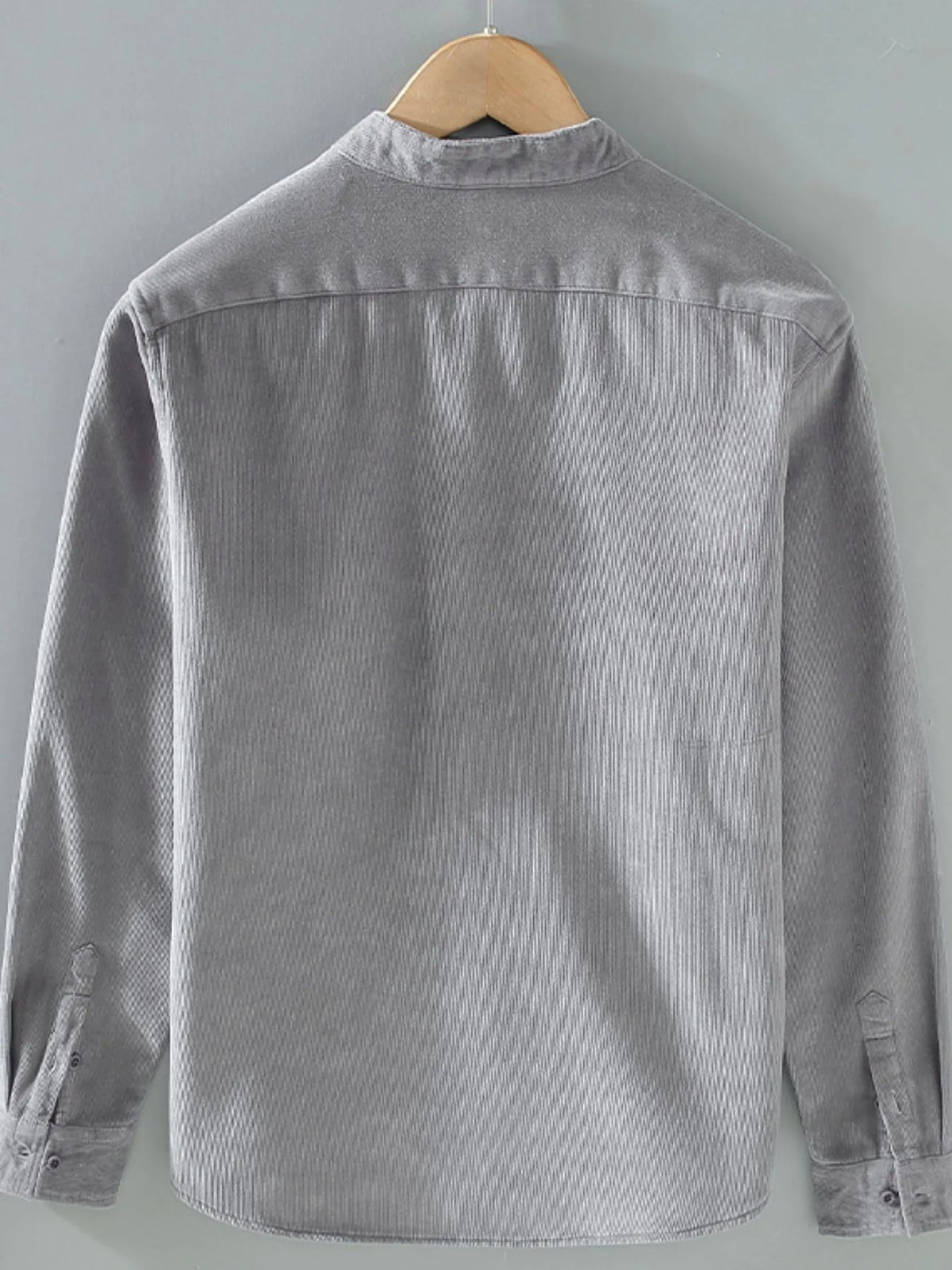 Men's plus size button-up long sleeve jacket by Trendsi, showcasing a stylish and comfortable outerwear design with a classic fit.