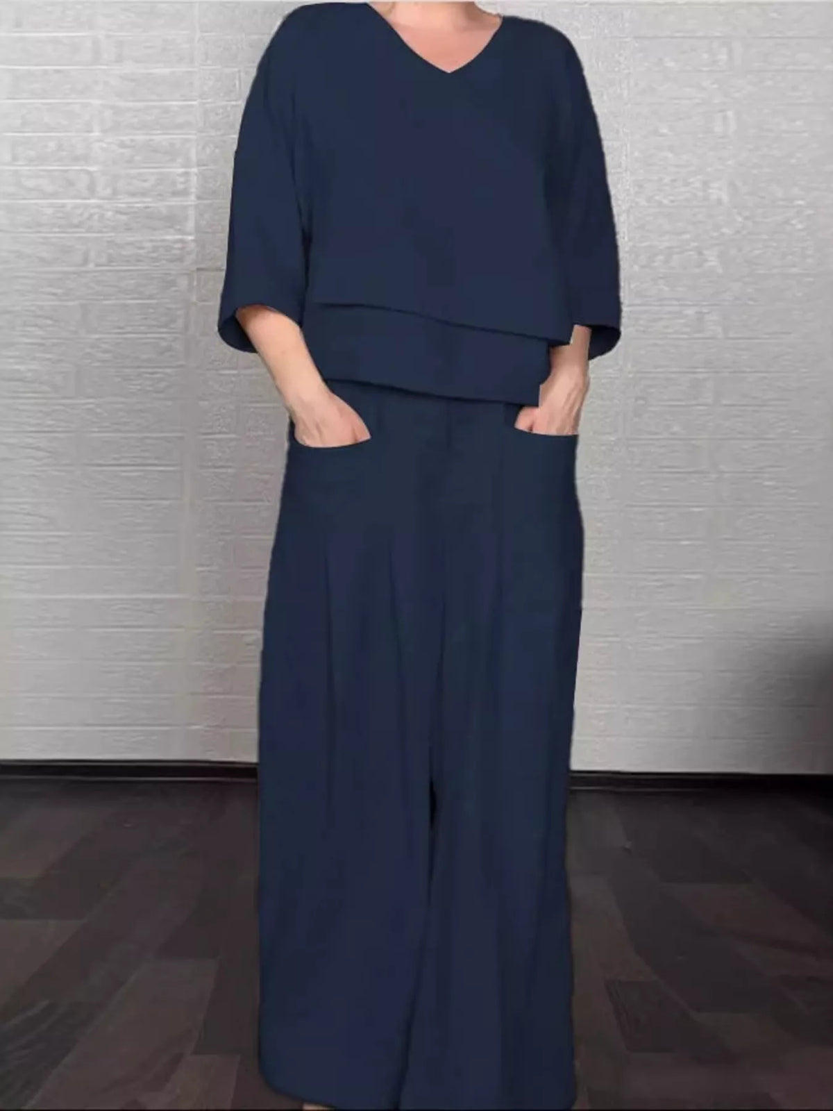 Plus size full V-neck long sleeve top and pants set from Trendsi, stylish matching outfit for casual or lounge wear.