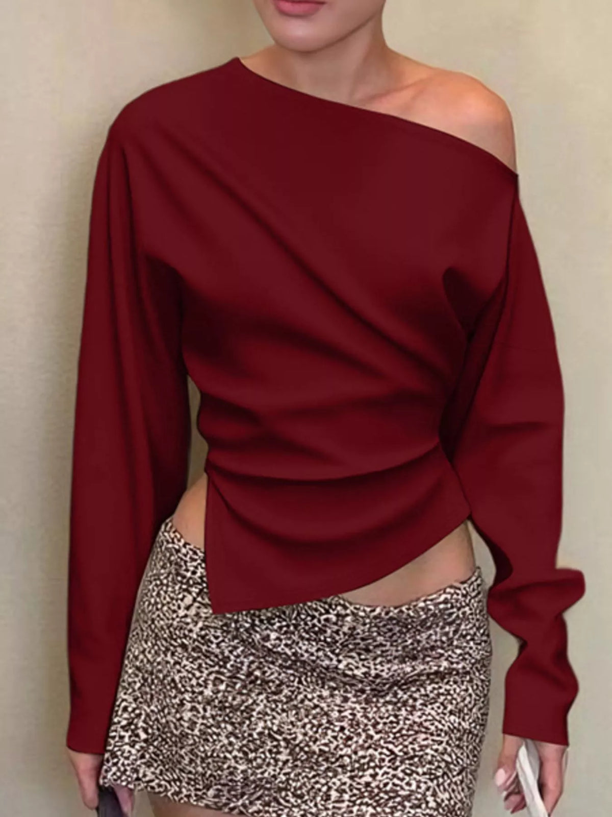 Asymmetrical off-shoulder long sleeve T-shirt by Plush Fashion Hub, featuring stylish design and fitted long sleeves.