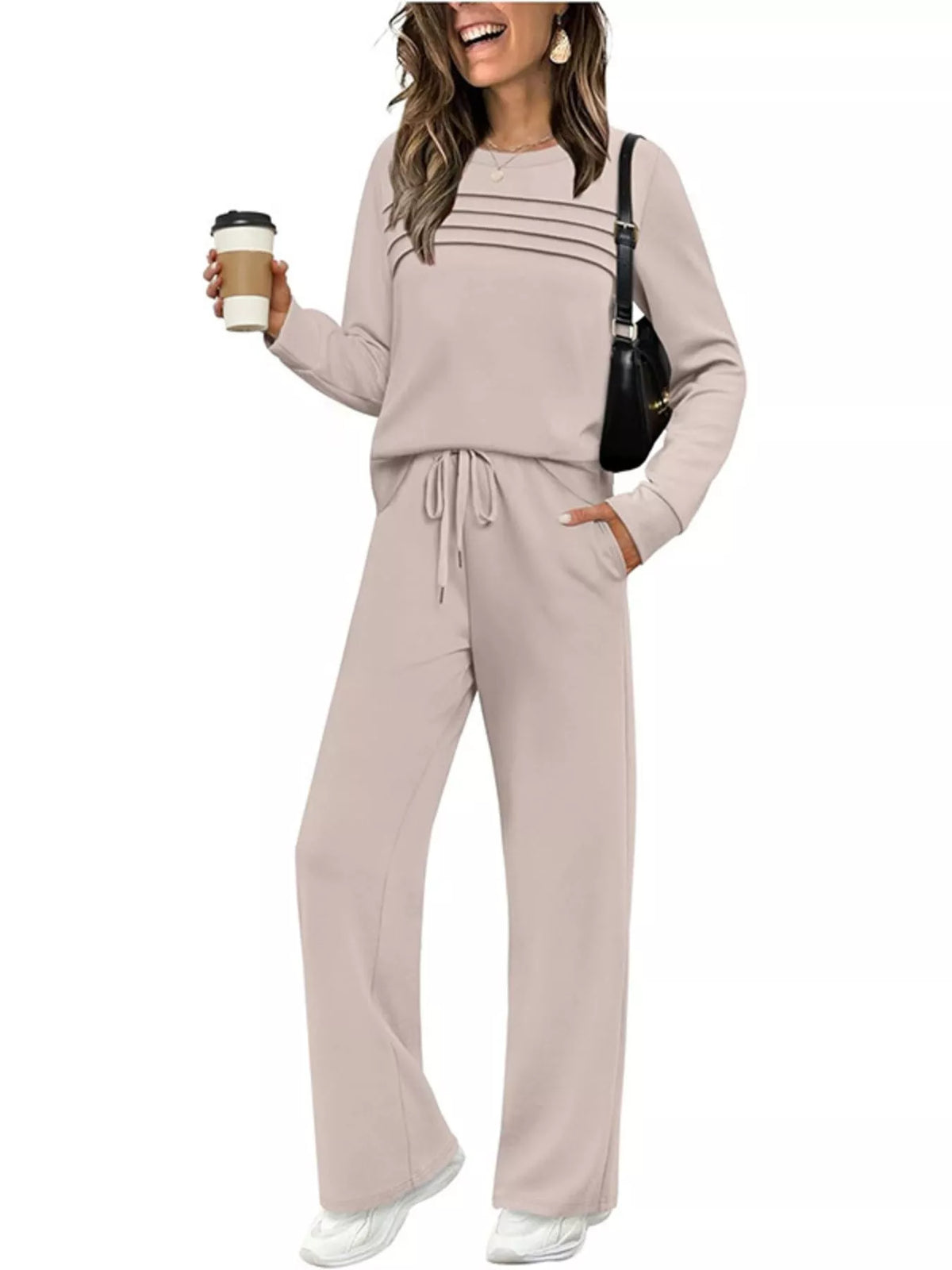 Plus size casual long sleeve crewneck top and drawstring pants set by Trendsi, featuring comfortable fabric and relaxed fit.