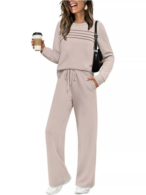 Plus size casual long sleeve crewneck top and drawstring pants set by Trendsi, featuring comfortable fabric and relaxed fit.