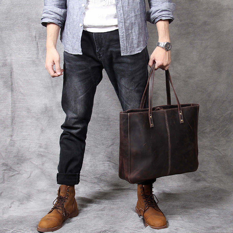 Pi-Mart simple retro cowhide large-capacity handbag for men, featuring a classic design and spacious interior.