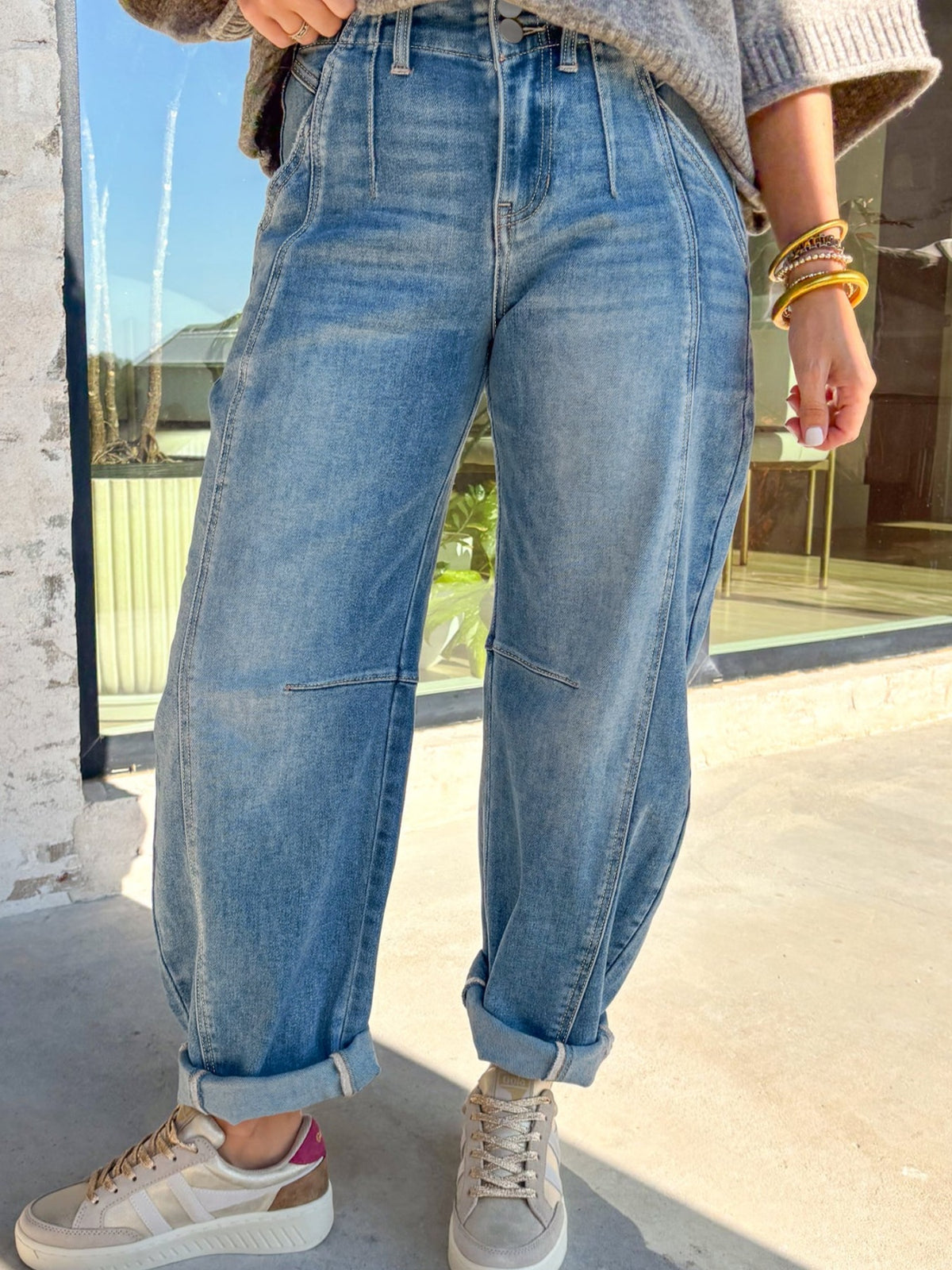 Washed cuffed barrel leg jeans by Plush Fashion Hub, vintage relaxed fit denim bottoms with a stylish, casual look.