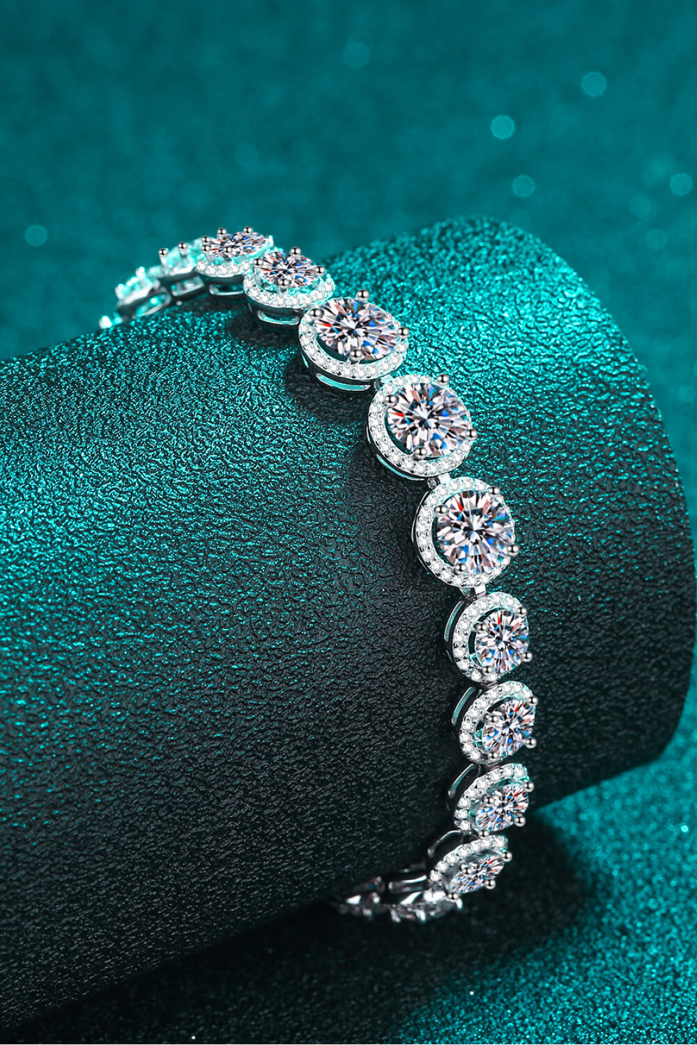 Sterling silver bracelet with sparkling 10.4 carat moissanite stones, elegant jewelry piece showcasing brilliance and craftsmanship.