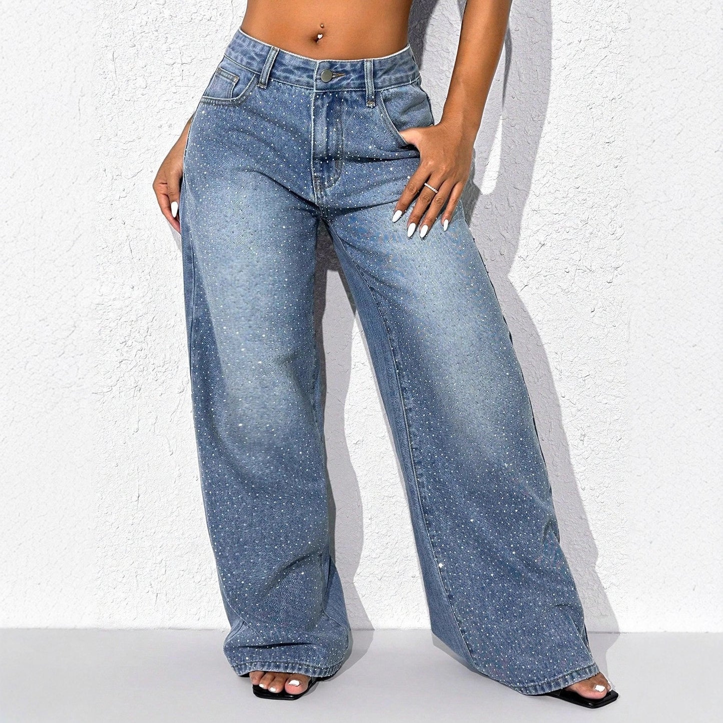 Eprolo embellished high-waisted wide-leg denim jeans with decorative details and relaxed fit, shown on a model.