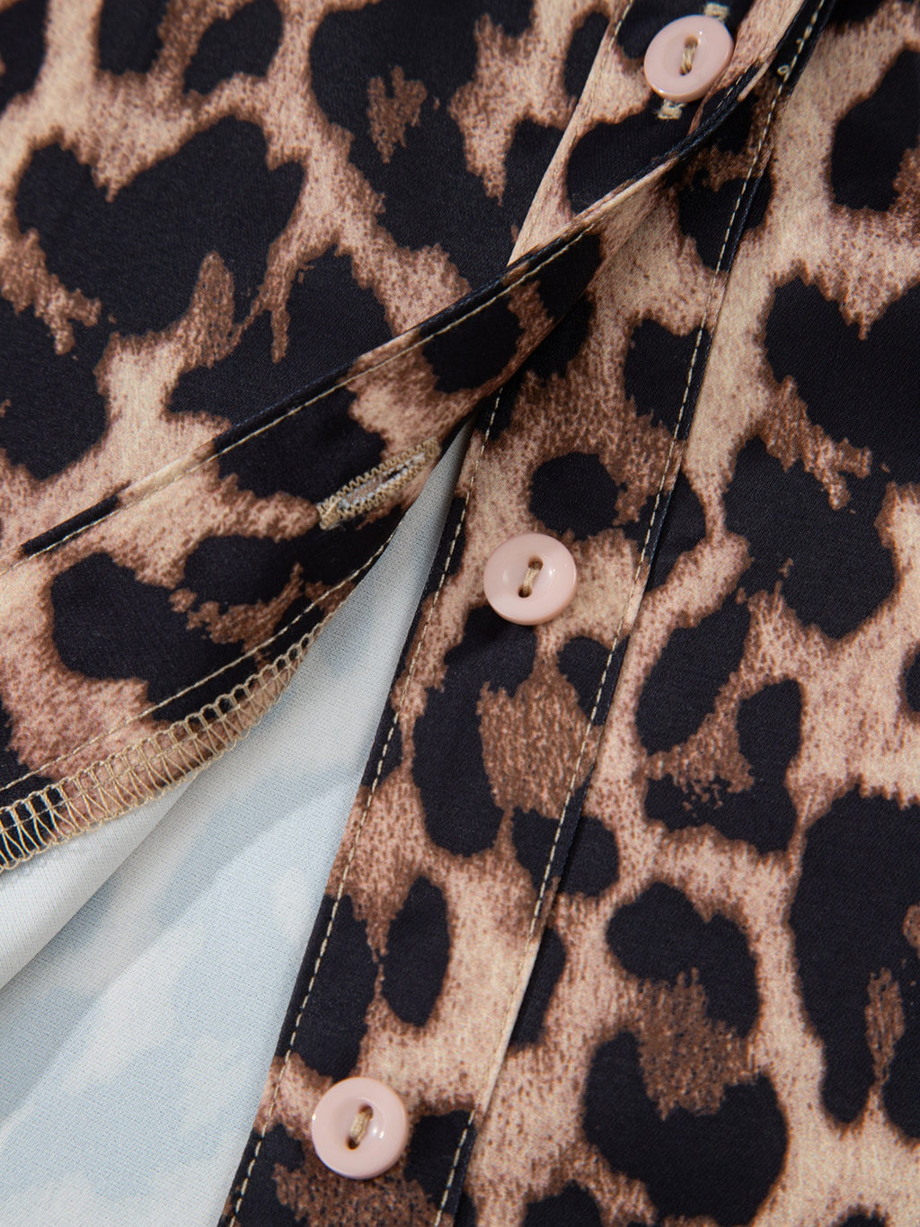 Leopard print short sleeve blouse from Trendsi with lace trim, button front, and stylish design, perfect for casual or chic outfits.