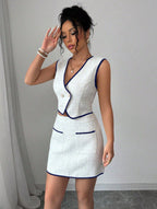 Casualwear set including a sleeveless irregular top and color-block pocket A-line skirt by FitiqueFit, displayed on a model.