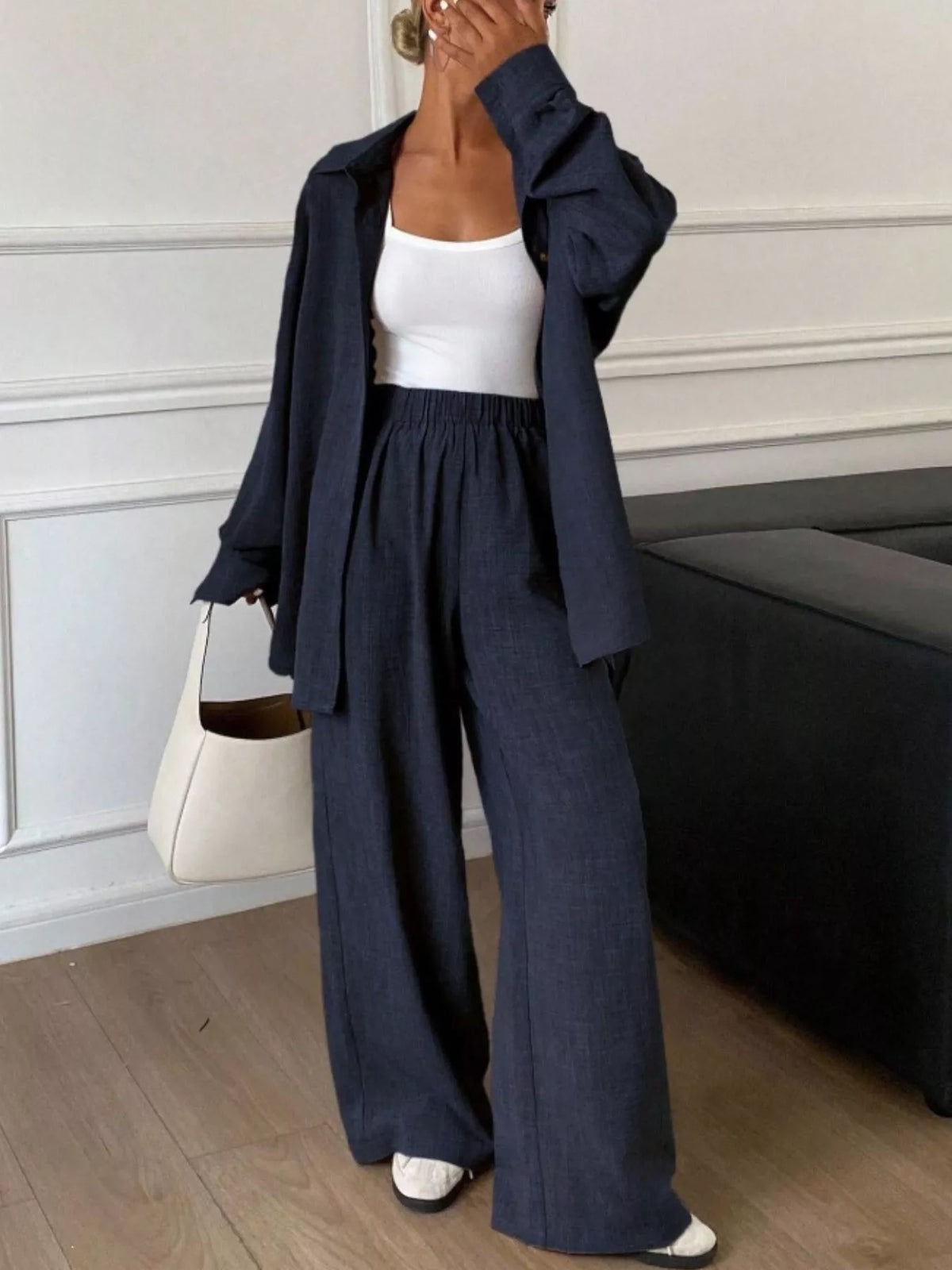 Trendsi long sleeve button-up shirt and wide-leg pants set shown in neutral tones, featuring classic collar and relaxed fit.