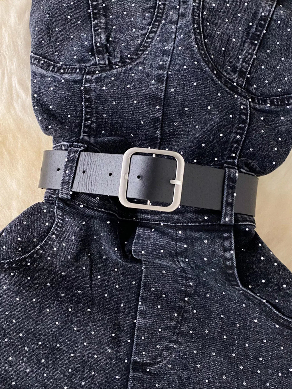 Plush Fashion Hub strapless denim romper with pockets, full-body suit featuring a stylish sleeveless design and functional front pockets.