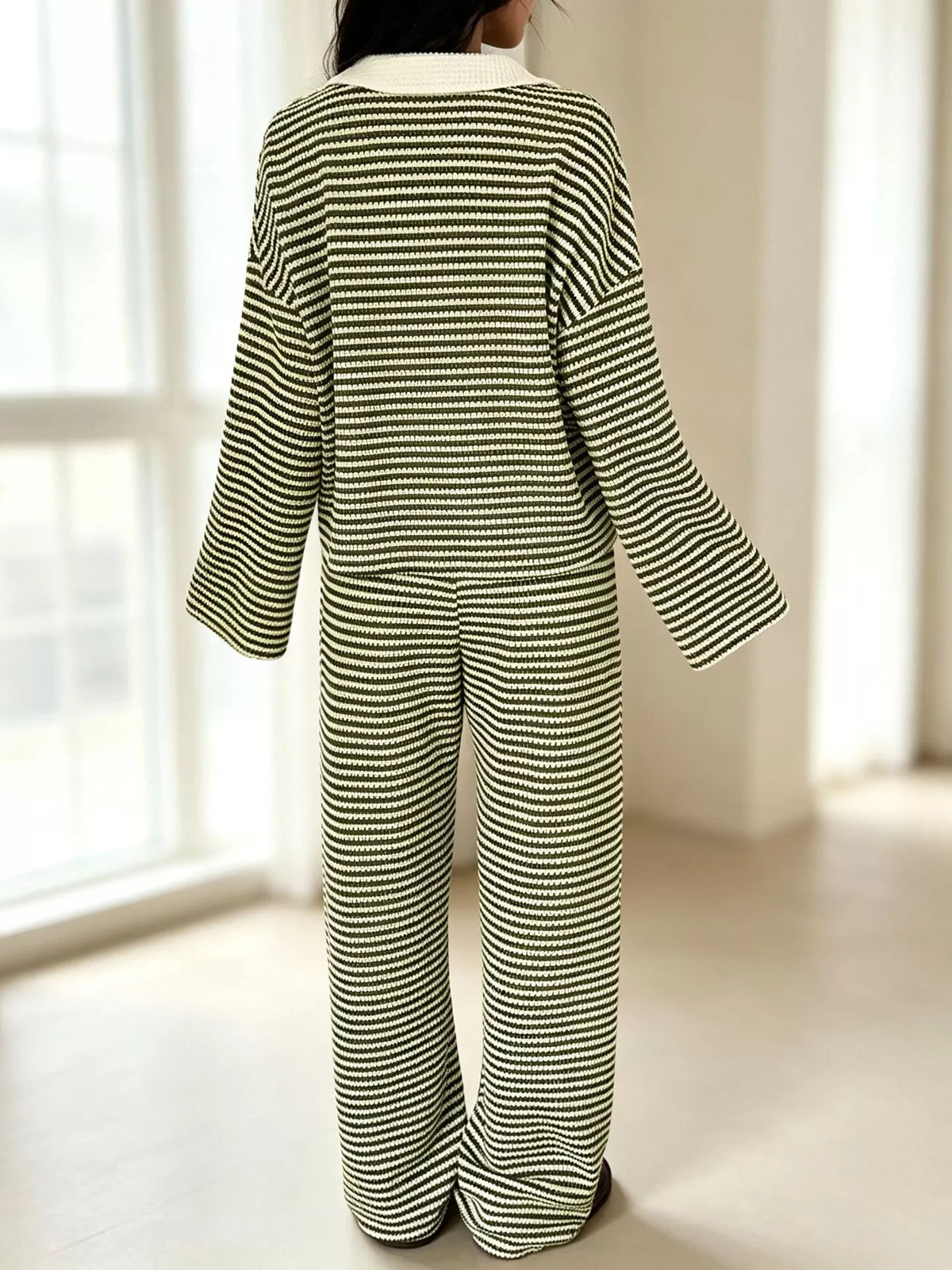 Striped long sleeve polo shirt and wide-leg pants set by Trendsi, featuring a stylish, casual outfit with bold stripe details.