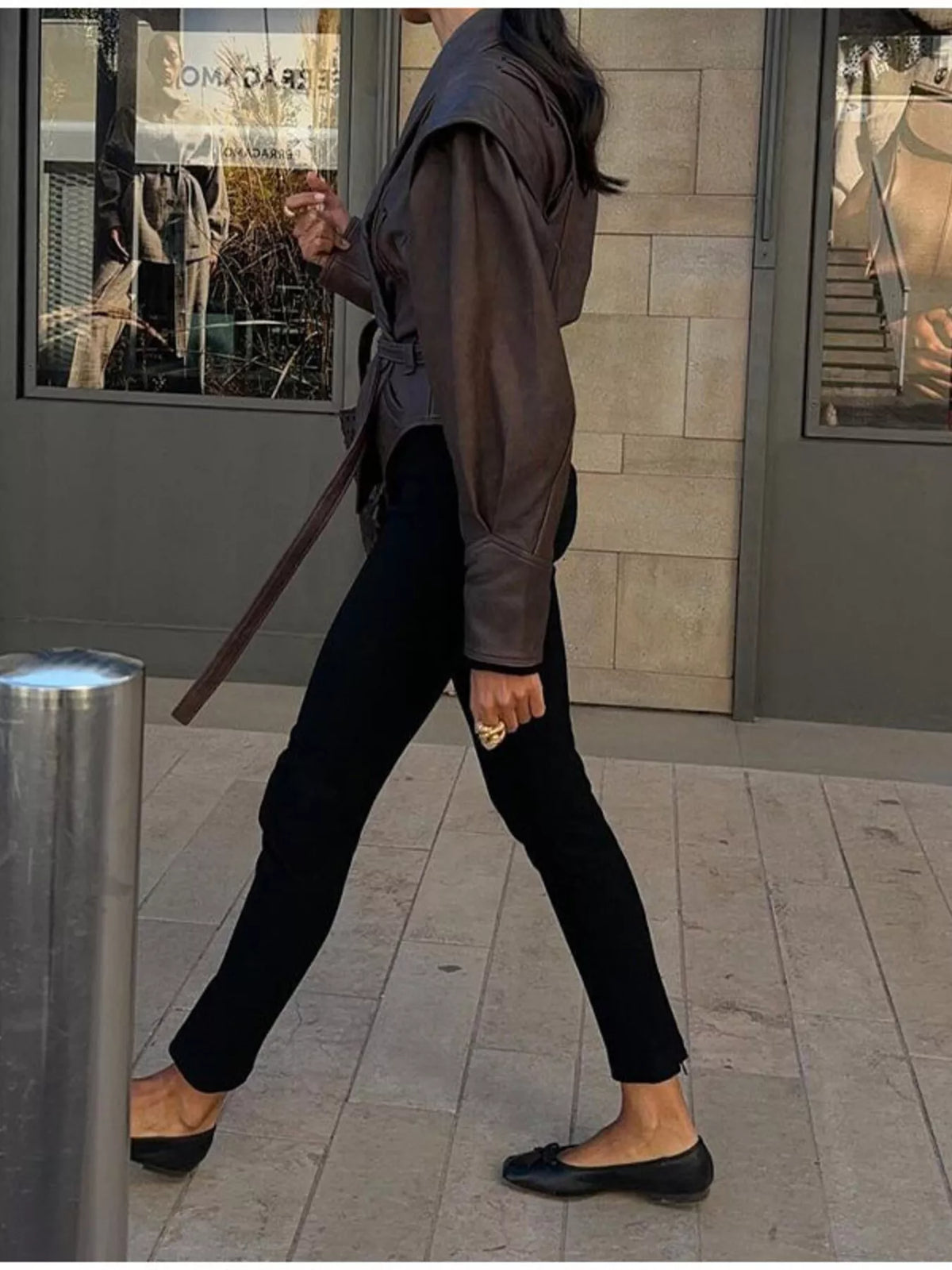 Women's leather belted jacket with shawl collar, stylish outerwear by Trendsi, featuring a sleek design and classic silhouette.