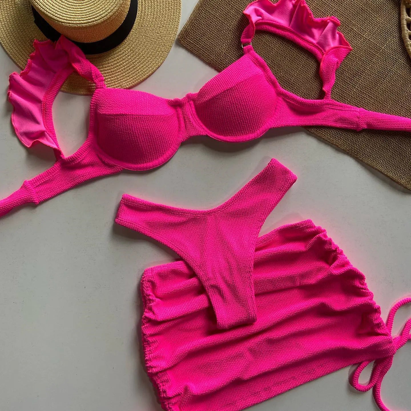 Women's solid color three-piece bikini set from Trendy Attic Store01, featuring a bikini top, bottom, and cover-up in vibrant fabric.