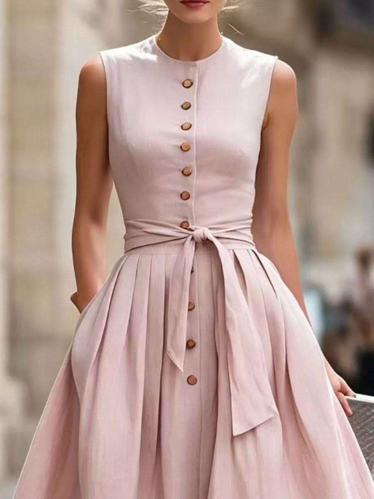 Plus size sleeveless button-front belted midi dress by Trendsi, showing the dress's front view with a waist belt and button details.