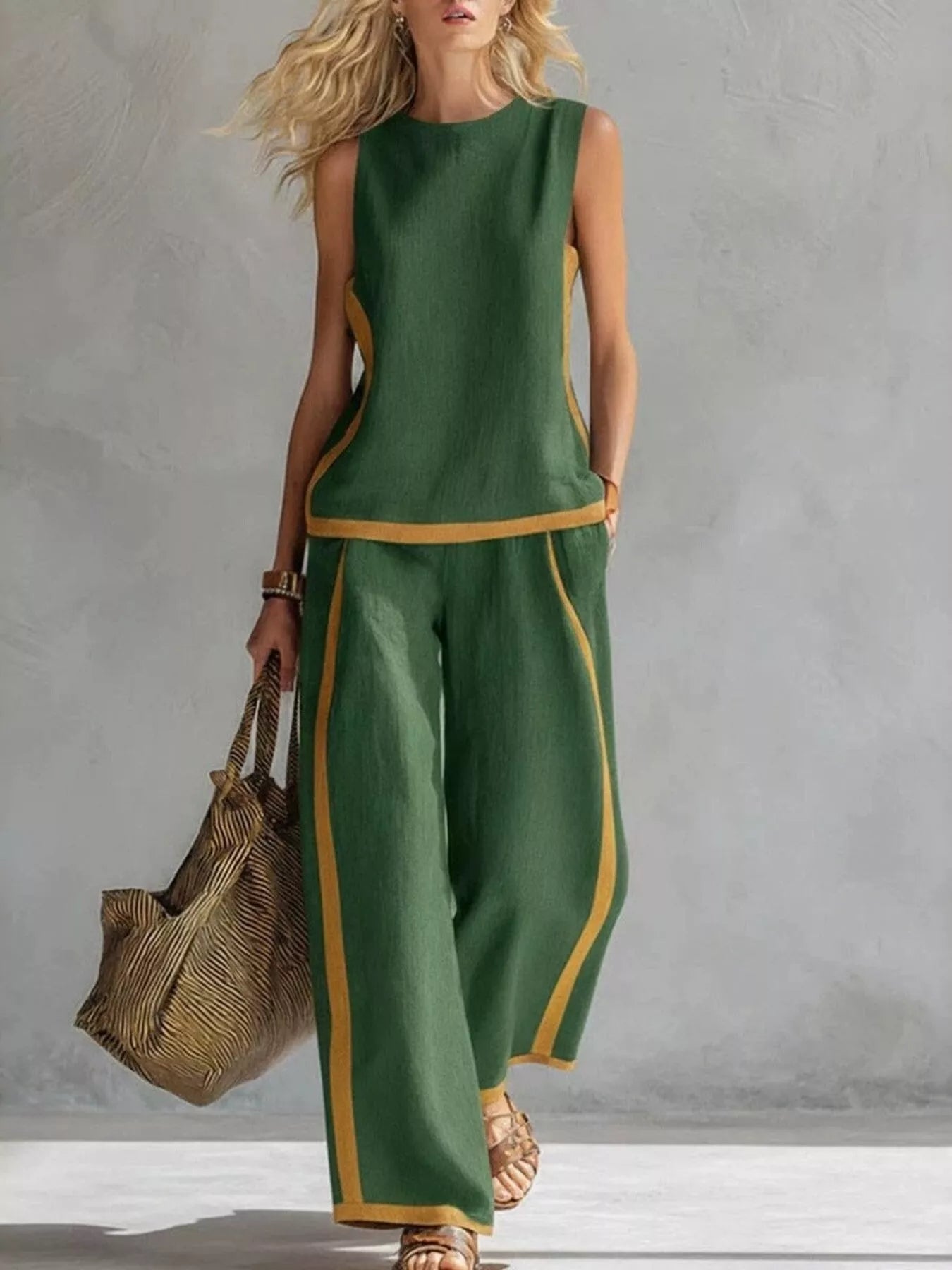 Full size contrast stripe sleeveless top and wide-leg pants set by Trendsi, featuring bold stripes and comfortable plus size fit.