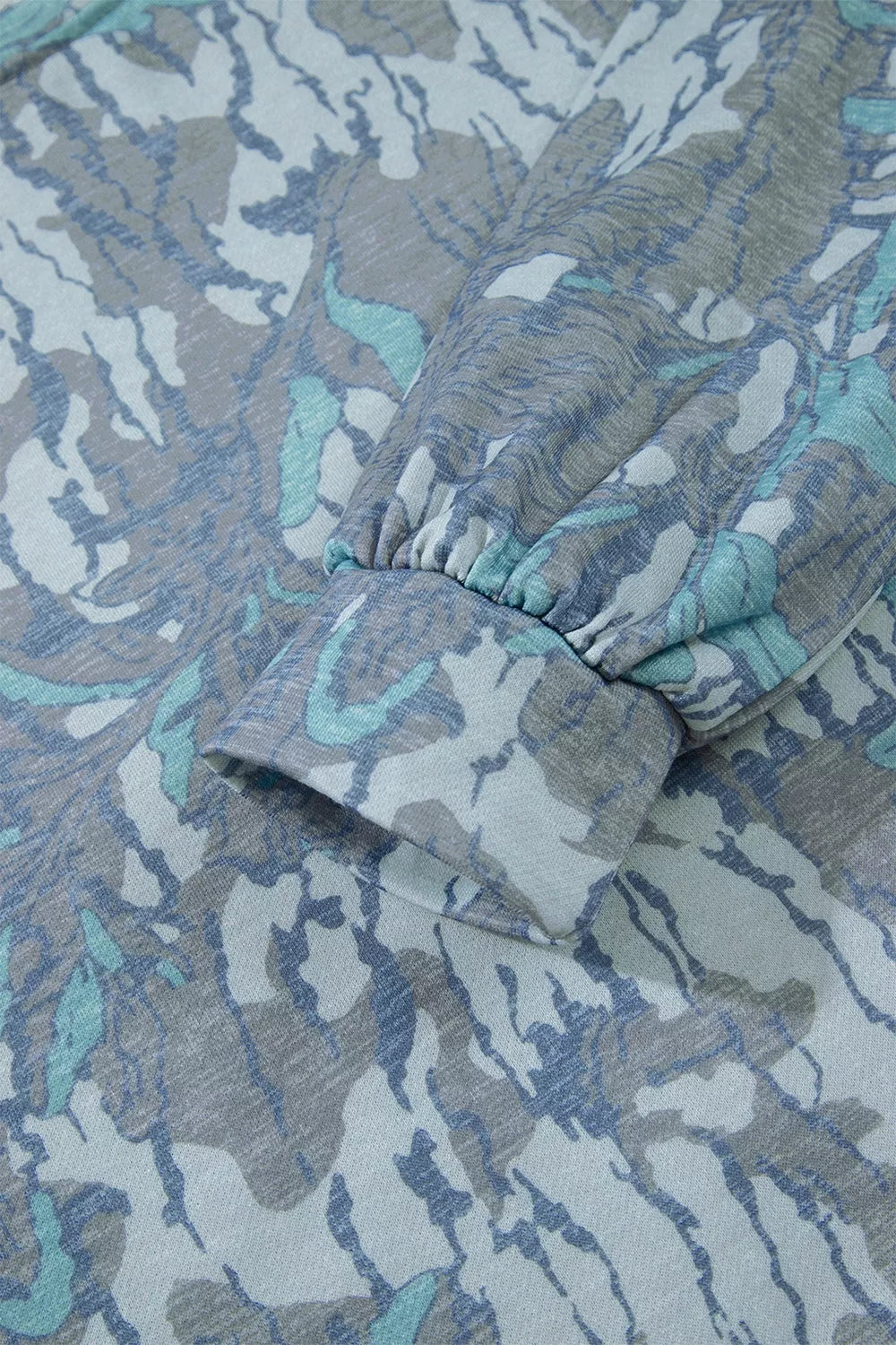 Multicolour abstract botanical print top and drawstring pants set by Trendsi, featuring vibrant floral patterns and comfortable fit.