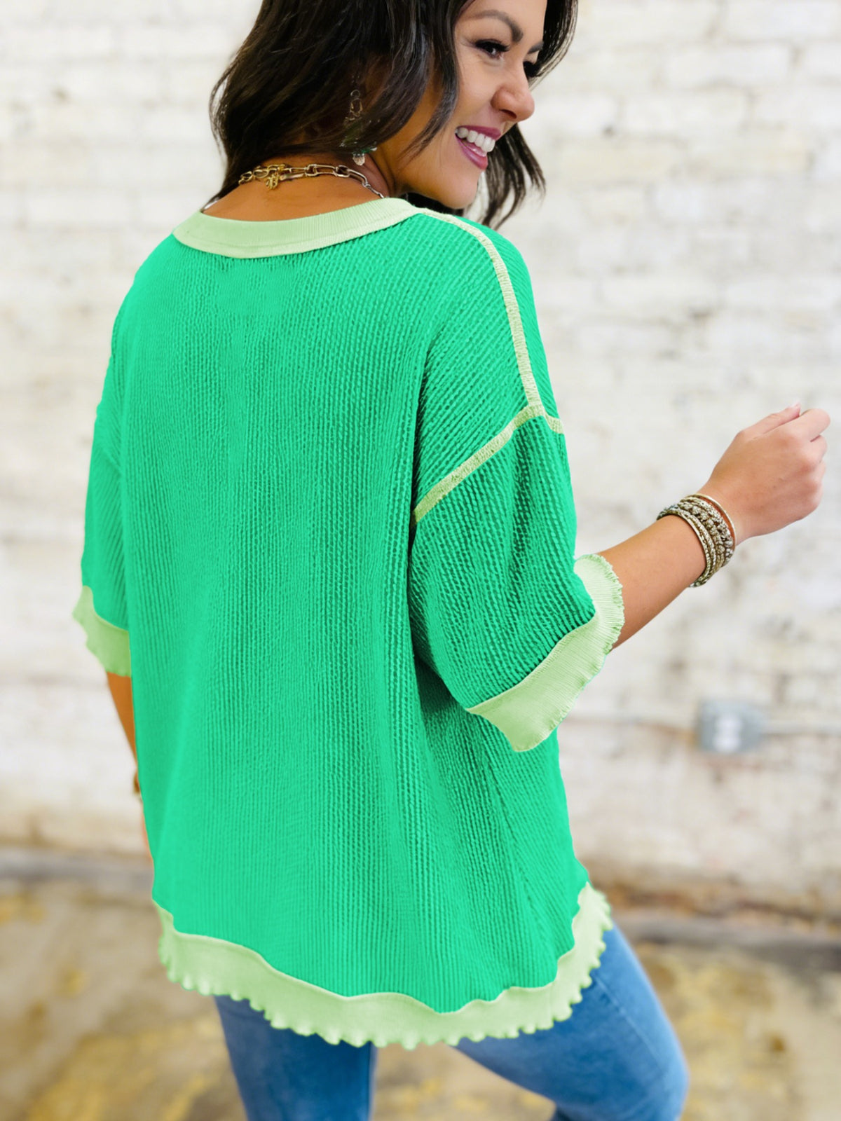 Women’s ribbed short sleeve T-shirt by Plush Fashion Hub featuring twist hem and contrast stitching, shown in a casual fit.