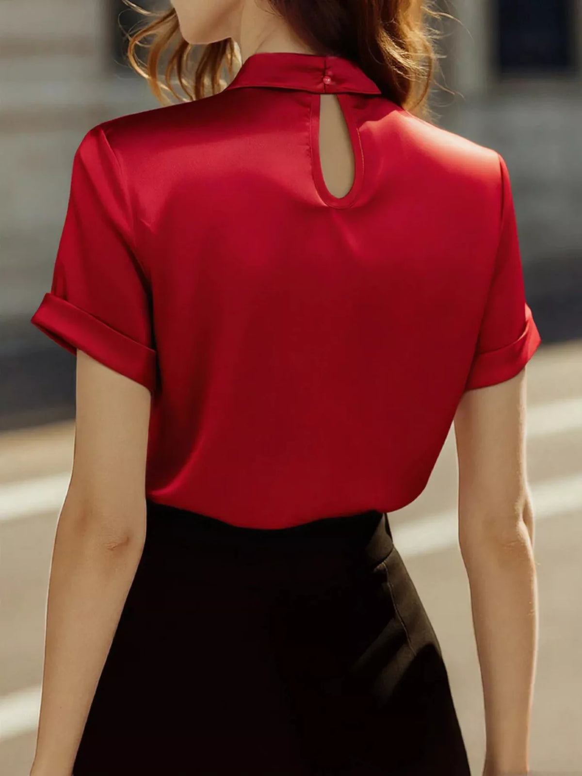 Plush Fashion Hub satin keyhole short sleeve blouse with a stylish fit and smooth fabric, displayed on a hanger.