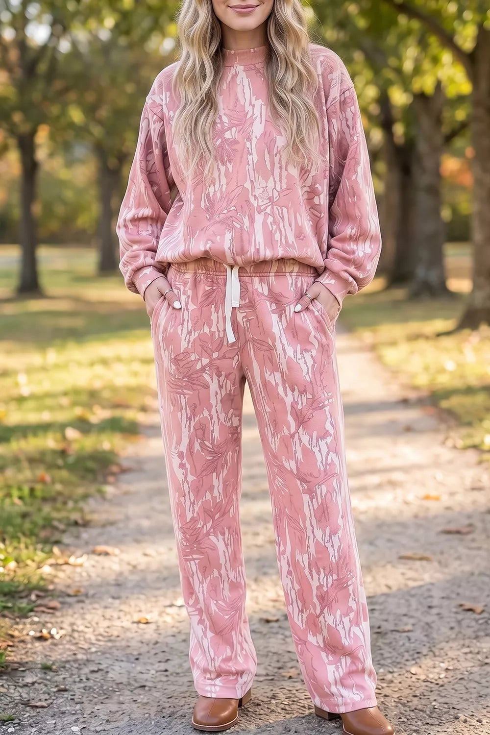 Multicolour abstract botanical print top and drawstring pants set by Trendsi, featuring vibrant floral patterns and comfortable fit.