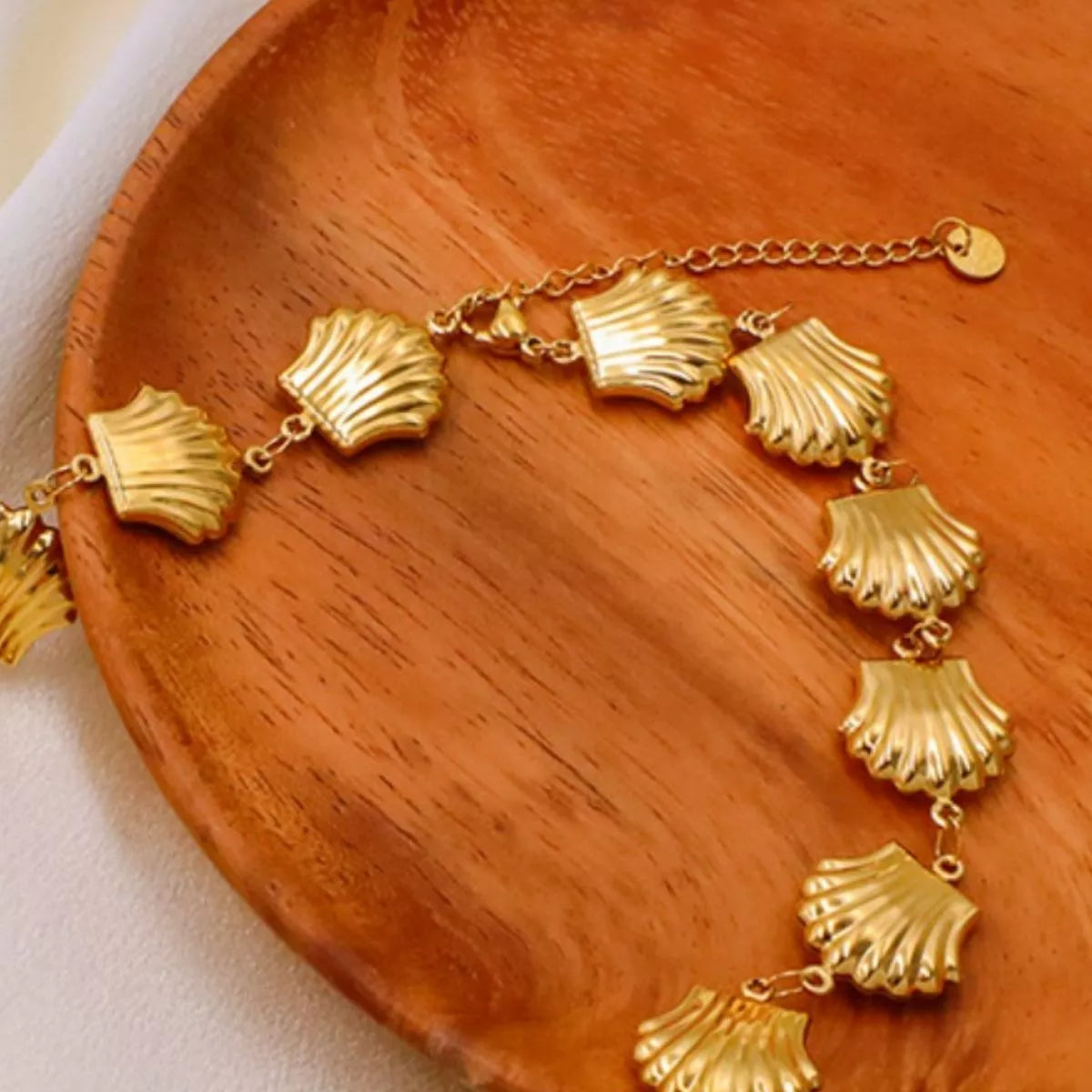 Gold-plated shell necklace from Plush Fashion Hub featuring a delicate chain and ocean-inspired shell pendant.