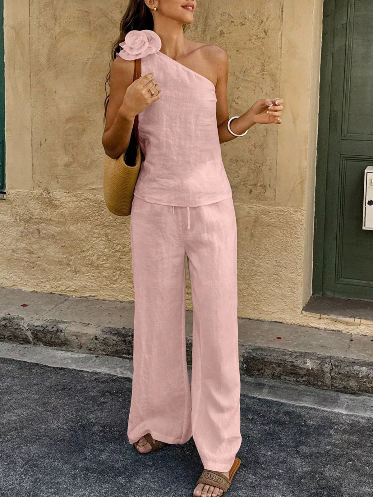 Plush Fashion Hub one-shoulder floral embellished top and matching pants set, stylish and elegant women's fashion ensemble.
