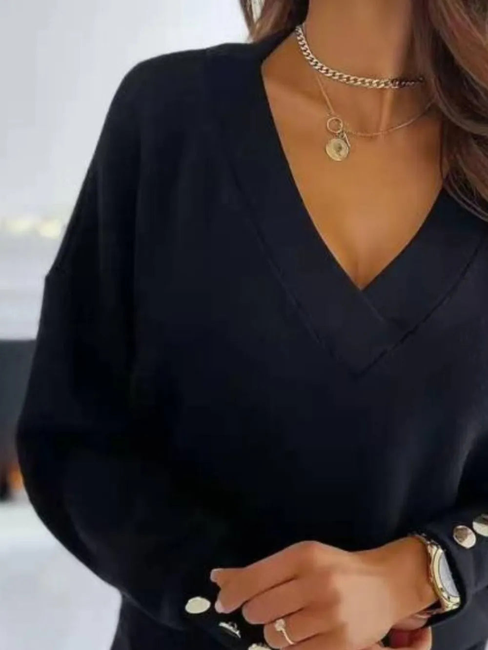 V-neck long sleeve sweatshirt in soft fabric from Trendsi, featuring a relaxed fit and classic design.