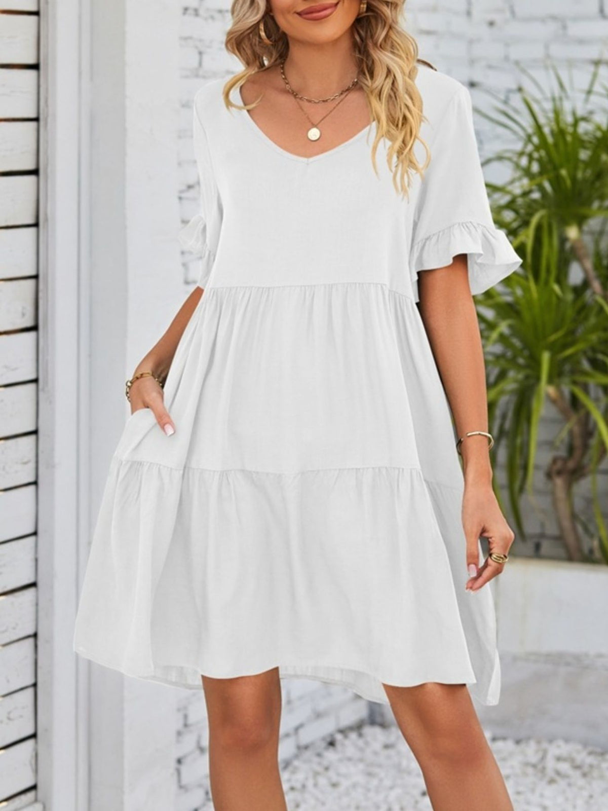 Lightweight rayon mini dress by Plush Fashion Hub with ruffled sleeves, tiered design, and side pockets for a stylish, casual look.