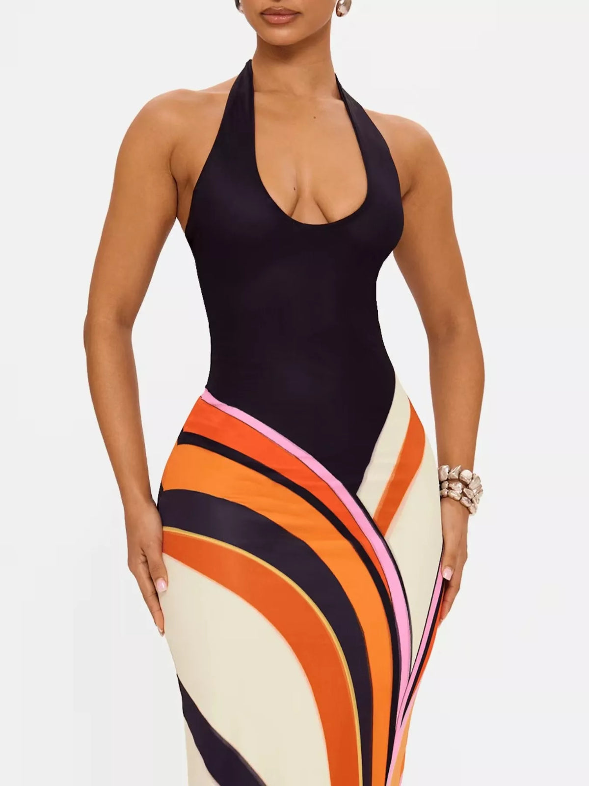 Halter neck maxi dress with abstract print from Plush Fashion Hub, flowing fabric and stylish design for summer wear.
