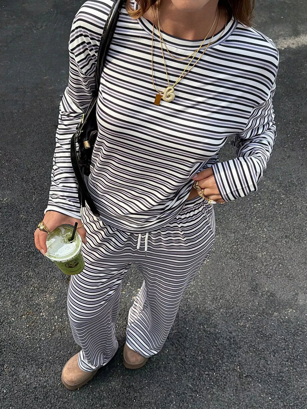 Women’s striped casual long sleeve top and wide-leg pants set by Trendsi, featuring stylish long sleeve and comfortable fit.