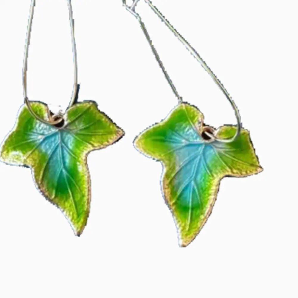 Silver alloy leaf drop earrings featuring intricate leaf design, perfect for elegant and stylish accessory wear.