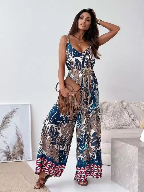 Printed spaghetti strap wide-leg jumpsuit by Plush Fashion Hub, featuring a stylish design and comfortable fit.