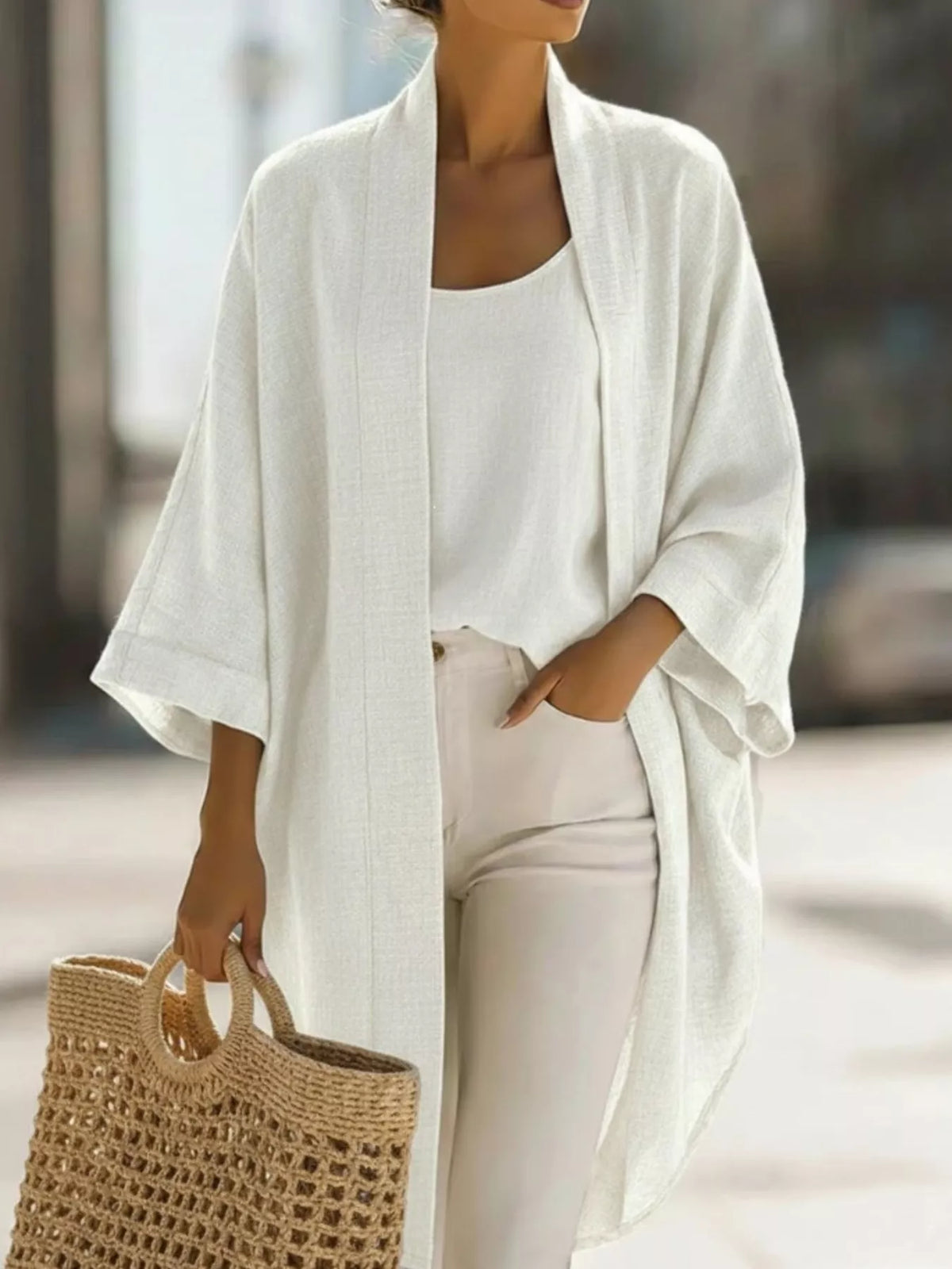 Plus size Trendsi open-front cardigan and matching tank top set, featuring a cozy, stylish design and soft fabric.