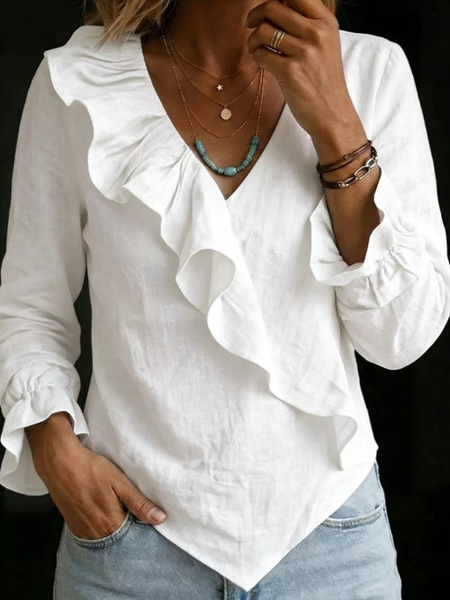 Plus size ruffled long sleeve blouse from Trendsi, featuring a full size, elegant design with feminine ruffle details.