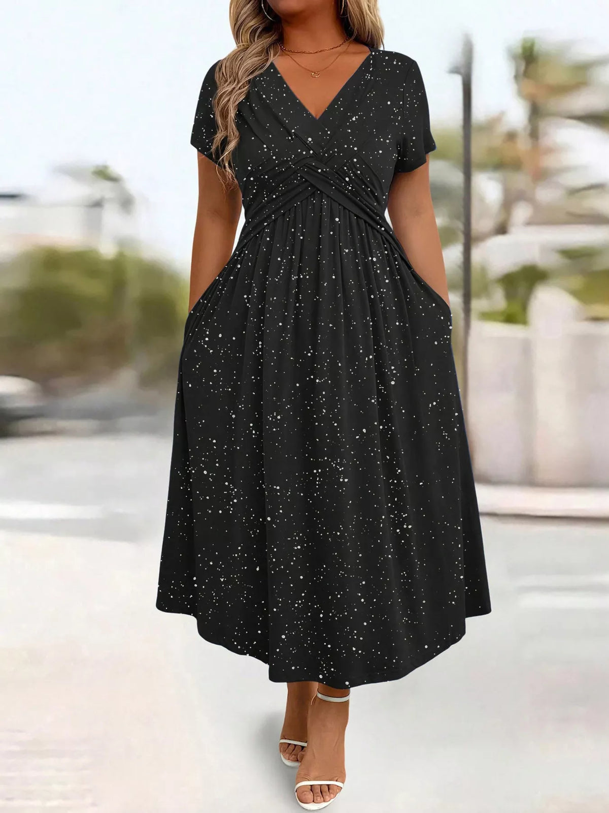 Plus size glitter flutter sleeve midi dress by Trendsi, shown in a full-length view with shimmering fabric and flutter sleeves.