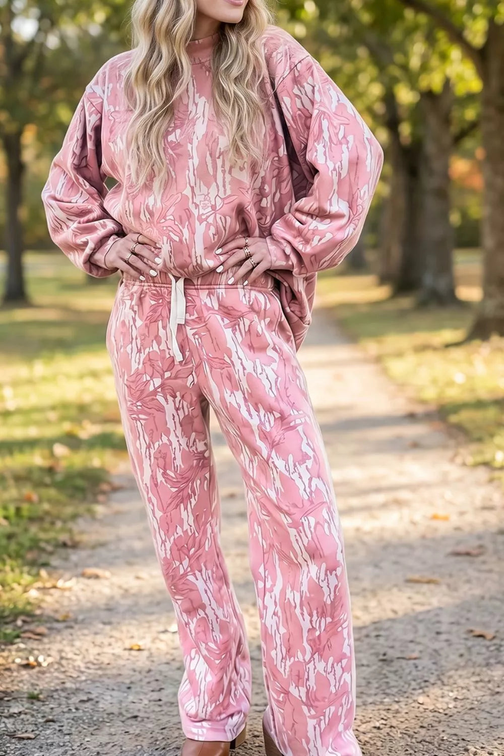 Multicolour abstract botanical print top and drawstring pants set by Trendsi, featuring vibrant floral design and comfortable fit.