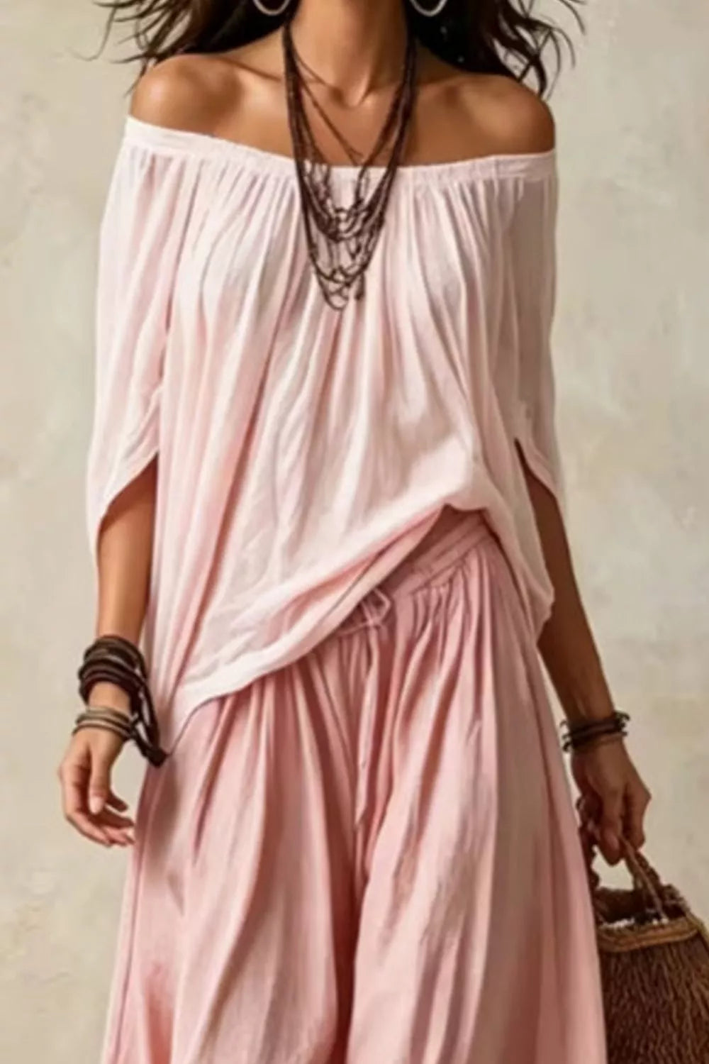 Plus size off-shoulder top and wide-leg pants matching set by Trendsi, featuring stylish, comfortable fashion in a coordinated design.