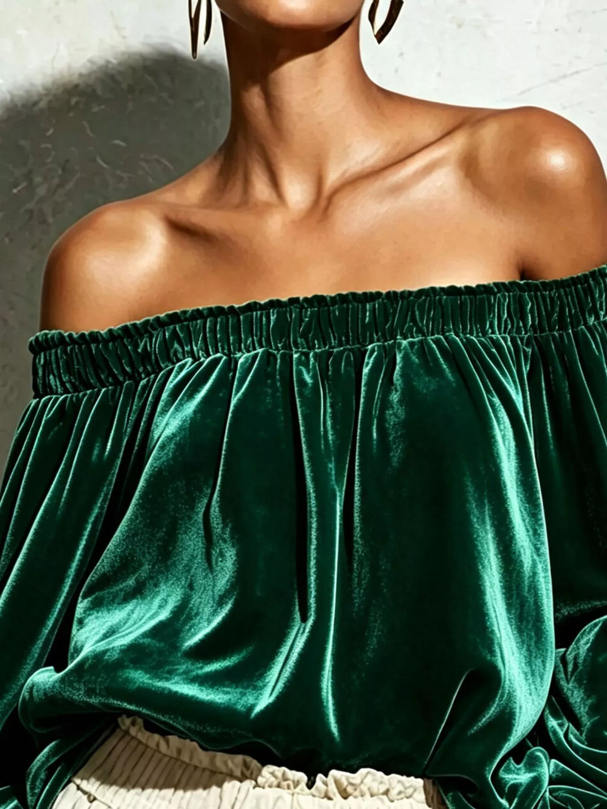 Off-shoulder velvet long sleeve T-shirt by Trendsi with a relaxed fit and stylish design, shown in a soft, rich velvet fabric.