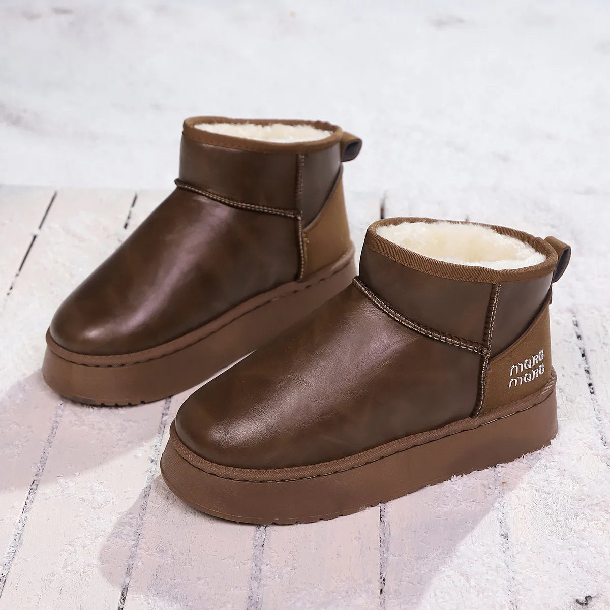 Faux-fur platform ankle boots by Trendsi featuring a stylish design, chunky heel, and cozy faux fur lining.
