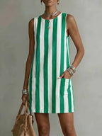 Women's striped color-block sleeveless mini dress by Plush Fashion Hub, loose fit casualwear with vibrant stripes and modern style.