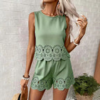 Women's elegant hollow-out floral top and pants set by FitiqueFit, casualwear with intricate floral and cut-out details.