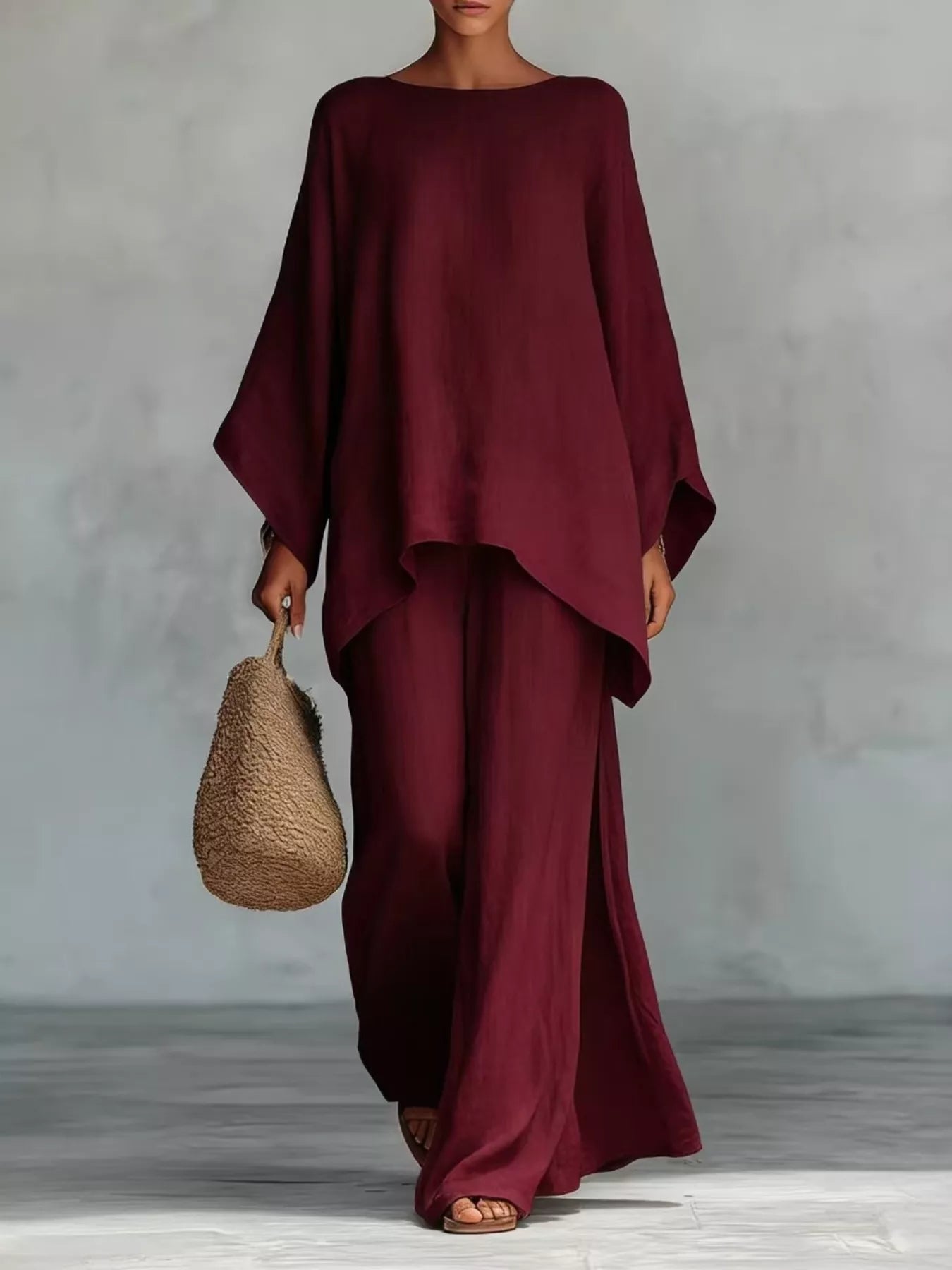 Plus size full size round neck top and wide-leg pants set by Trendsi, stylish matching pant set for casual wear.