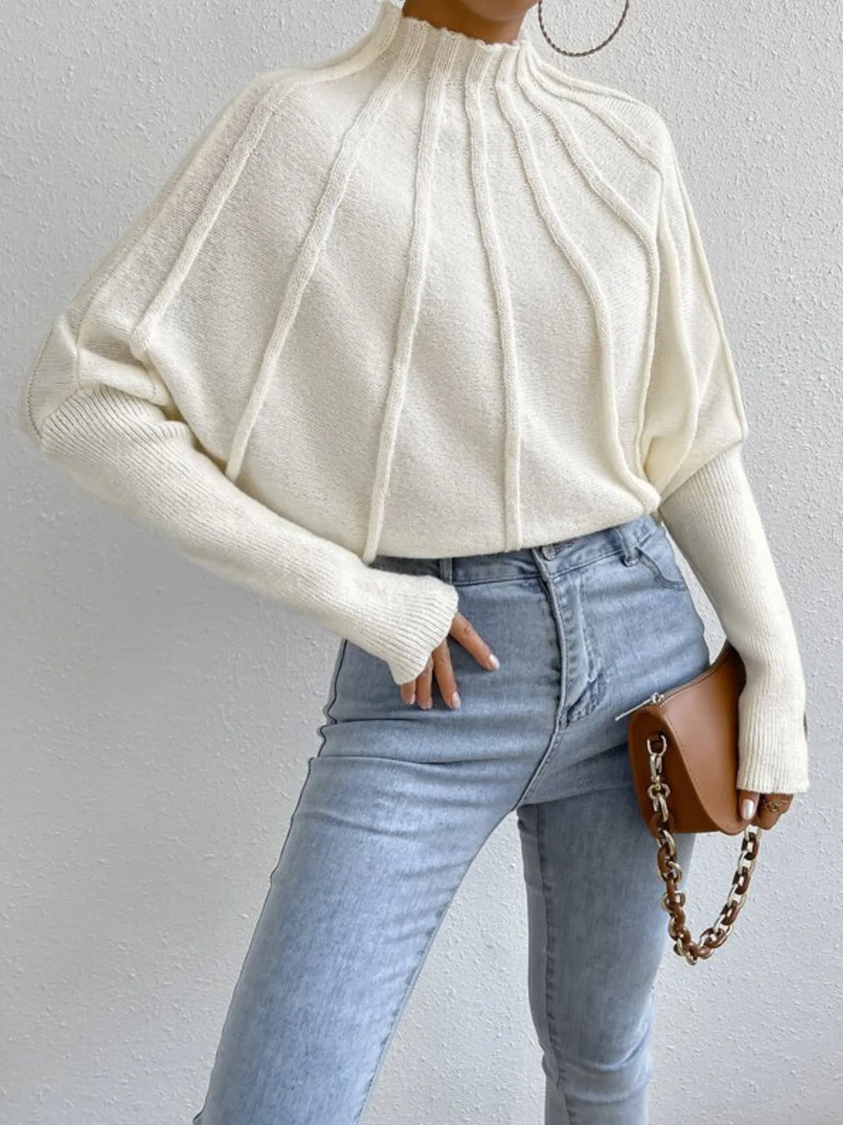 Ribbed mock neck long sleeve sweater from Trendsi, featuring a fitted design and soft knit fabric in a neutral color.