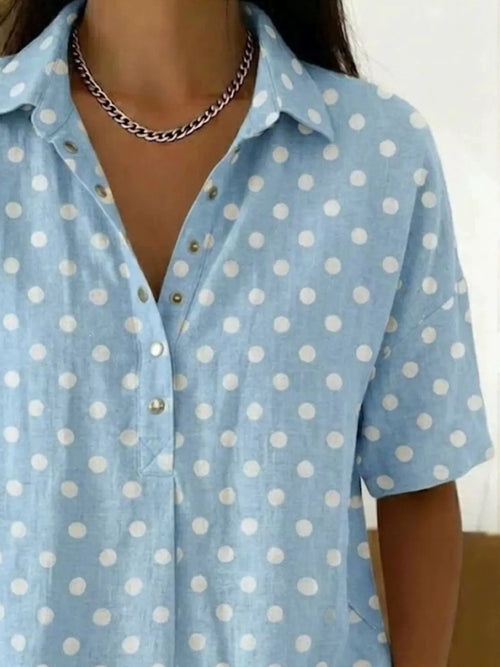 Plus size polka dot short sleeve shirt by Trendsi, casual tops with a full size fit and classic pattern, shown on a model.