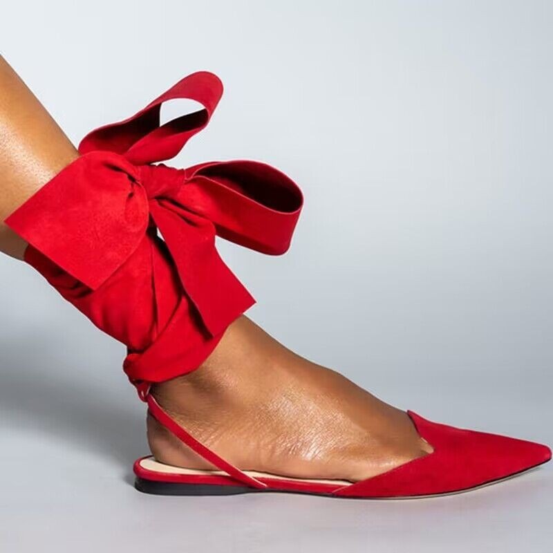 Plush Fashion Hub pointed toe ankle strap flats featuring sleek design and comfortable fit, perfect for casual or dressy occasions.