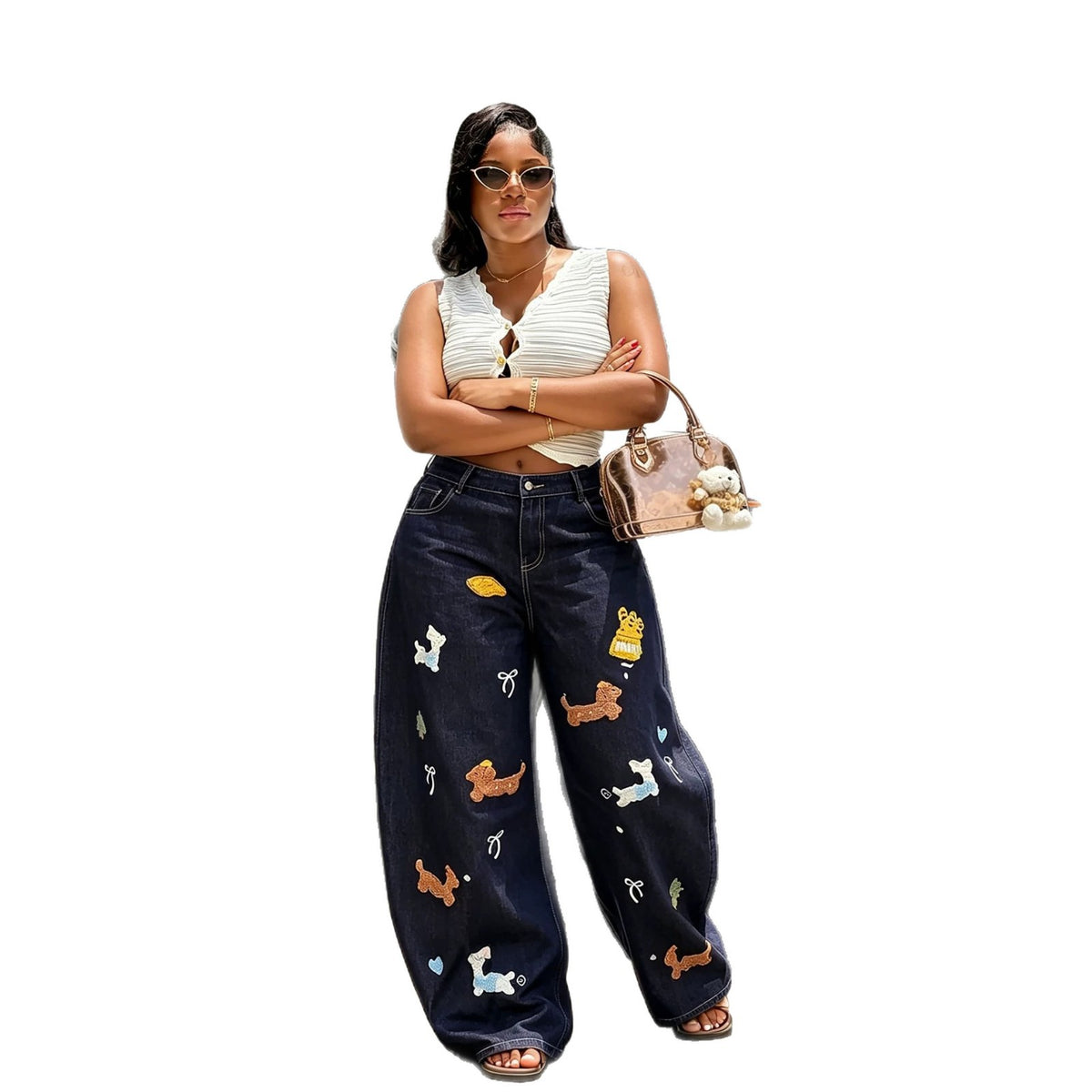 Cartoon embroidered knife design on blue denim jeans from Plush Fashion Hub, stylish embroidered denim pants with detailed artwork.