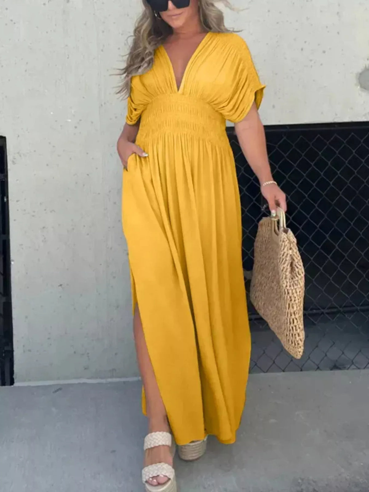 Plus size full slit V-neck maxi dress with smocked waist by Plush Fashion Hub, featuring a flowing silhouette and elegant design.