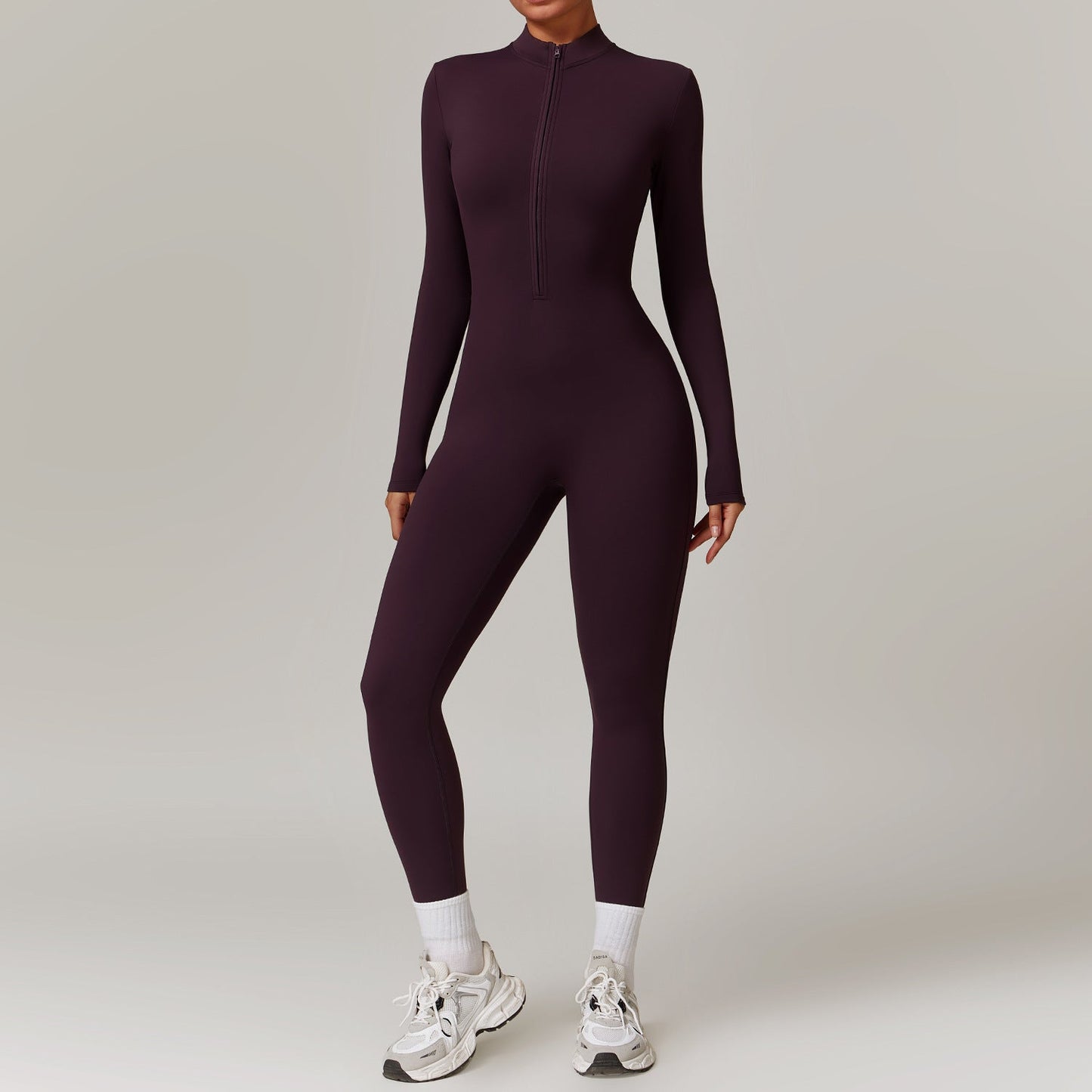 Warm zipper long-sleeved yoga fitness breathable bodysuit for women.